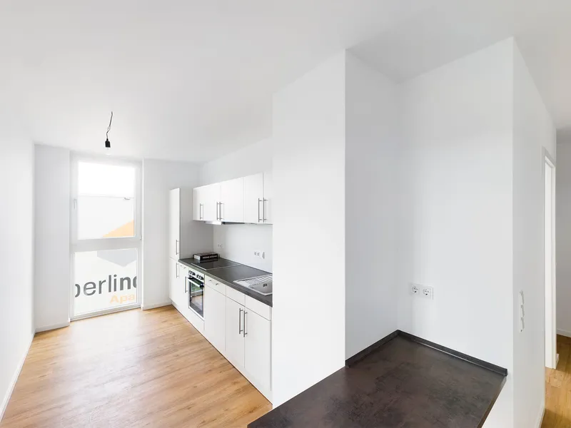 Neubau 3 Zimmer mit EBK, Aufzug und sonnigem Balkon — photo 1